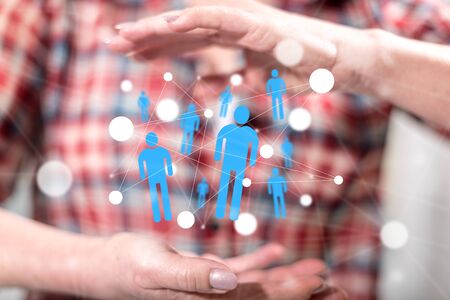Social network concept between hands of a woman in backgroundの写真素材
