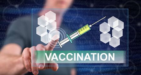 Man touching a vaccination concept on a touch screen with his fingerの写真素材