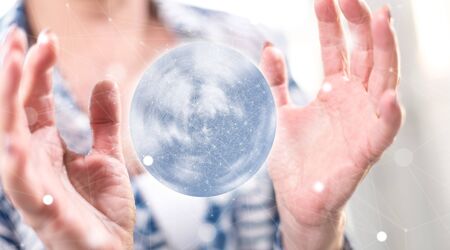 Global connection concept between hands of a woman in backgroundの写真素材
