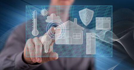Man touching a smart home concept on a touch screen with his fingerの写真素材