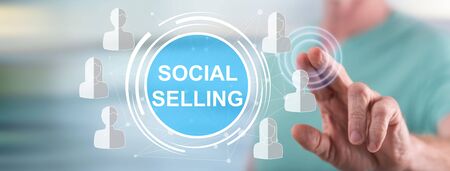 Man touching a social selling concept on a touch screen with his fingerの写真素材
