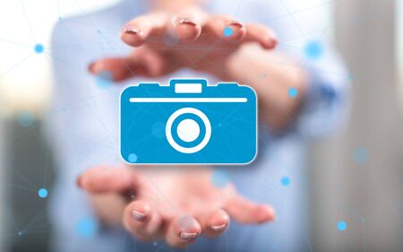 Photography concept between hands of a woman in backgroundの写真素材