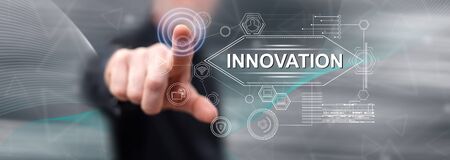 Man touching an innovation concept on a touch screen with his fingerの写真素材