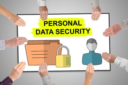 Personal data security concept on a whiteboard held by handsの写真素材