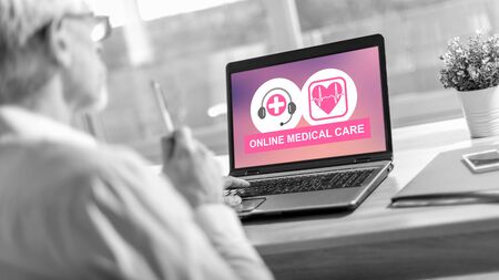 Laptop screen displaying an online medical care conceptの写真素材