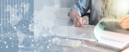 Businesswoman working on documents in office; multiple exposure