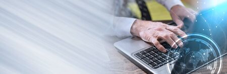 Businessman using laptop in office, double exposure, light effect. panoramic banner