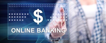 Woman touching an online banking concept on a touch screen with her fingerの写真素材
