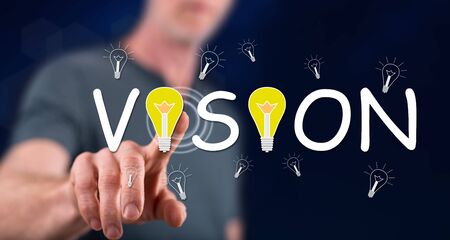 Man touching a vision concept on a touch screen with his fingerの写真素材