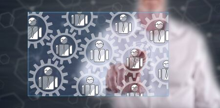 Man touching a teamwork concept on a touch screen with his finger