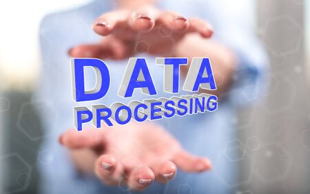 Data processing concept between hands of a woman in backgroundの写真素材