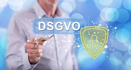 Man touching a gdpr concept (german text dsgvo) on a touch screen with a penの写真素材