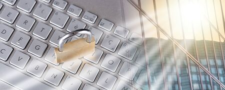 Padlock on computer keyboard; multiple exposure