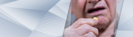 Old woman taking medication at home. panoramic banner