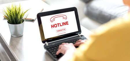 Laptop screen displaying a hotline conceptの写真素材