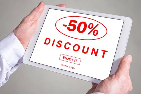 Tablet screen displaying a discount conceptの写真素材