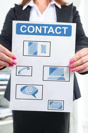 Paper with contact concept held by a businesswomanの写真素材