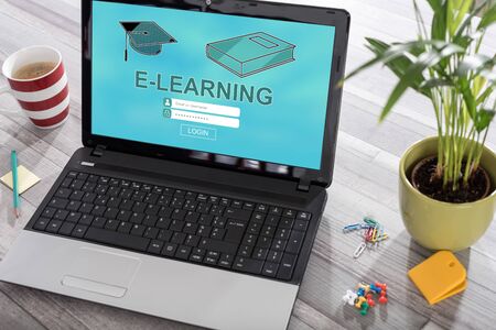 Laptop on a desk with e-learning concept on the screenの写真素材