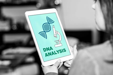 Tablet screen displaying a dna analysis conceptの写真素材
