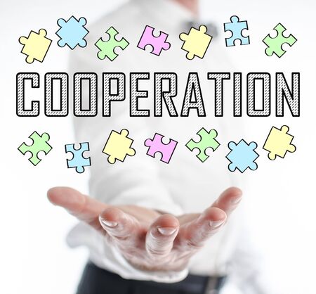 Cooperation concept levitating above a hand of a manの写真素材