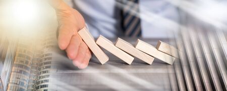 Business control concept by stopping domino effect; multiple exposure