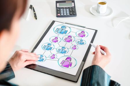 Woman looking at a social network conceptの写真素材