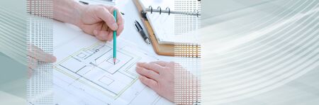 Architect showing house plans to his client; panoramic banner