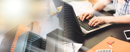 Female hands using a laptop in office; multiple exposure