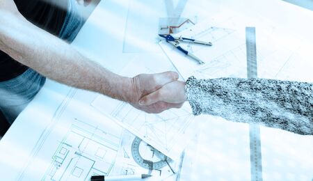 Architect shaking hands with his client; light effect