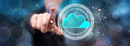 Man touching a cloud networking concept on a touch screen with his finger