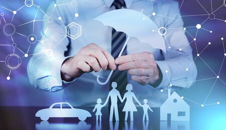 General agent protecting a family, a house and a car; light effectの写真素材