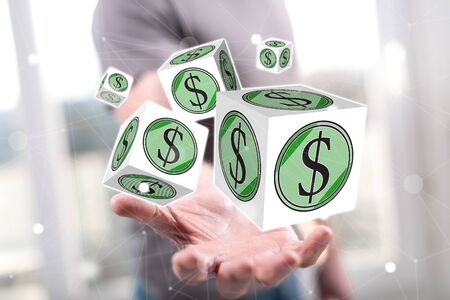 Dollar concept above the hand of a man in backgroundの写真素材