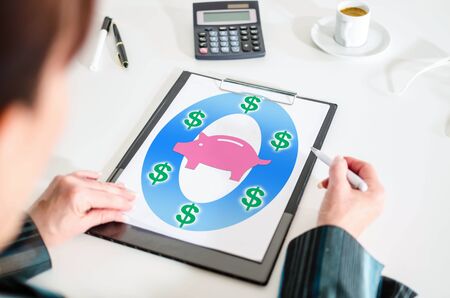 Woman looking at a saving money conceptの写真素材