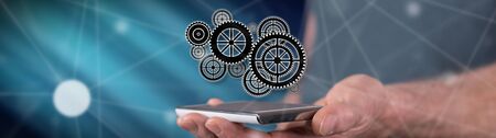 Teamwork concept above a smartphone held by a man