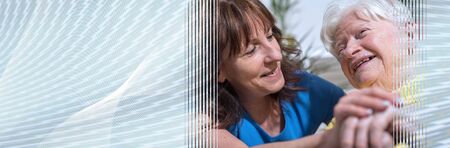 Portrait of happy grandmother with her daughter in visit; panoramic bannerの写真素材