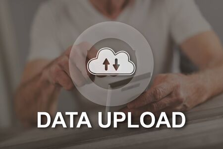 Data upload concept illustrated by a picture on backgroundの写真素材