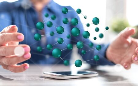 Smartphone with network concept between hands of a woman in background