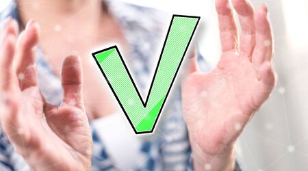 Validation concept between hands of a woman in backgroundの写真素材