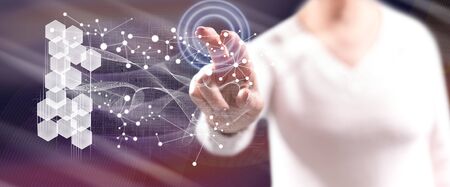 Woman touching a virtual network on a touch screen with her fingers
