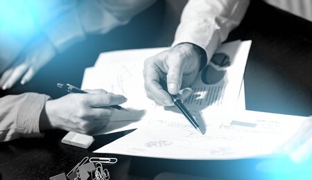Businesspeople working together in office; light effect