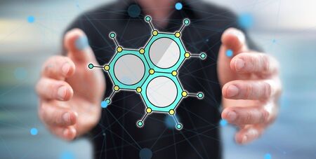 Scientific research concept between hands of a man in backgroundの写真素材