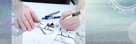 Architect working on plans of new house; panoramic banner