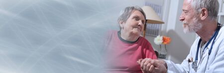 Doctor comforting an old patient; panoramic banner