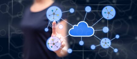 Woman touching a cloud networking on a touch screen with her finger
