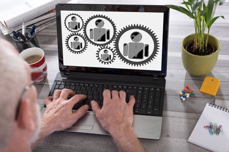 Business team concept shown on a laptop used by a manの写真素材