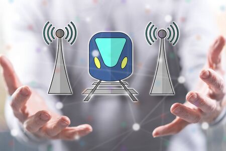 Smart train concept above the hands of a man in backgroundの写真素材