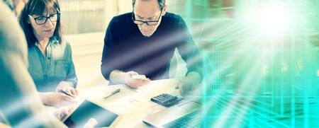 Business people working together in office, post processing; multiple exposure