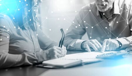 Businesspeople working together in office, light effect