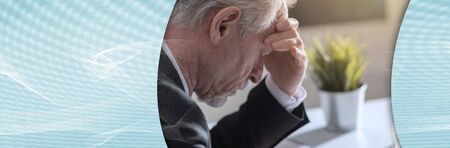 Overworked senior businessman having headache; panoramic banner