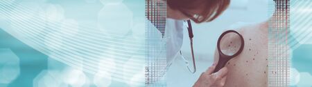 Dermatologist examining the skin on the back of a patient; panoramic bannerの写真素材
